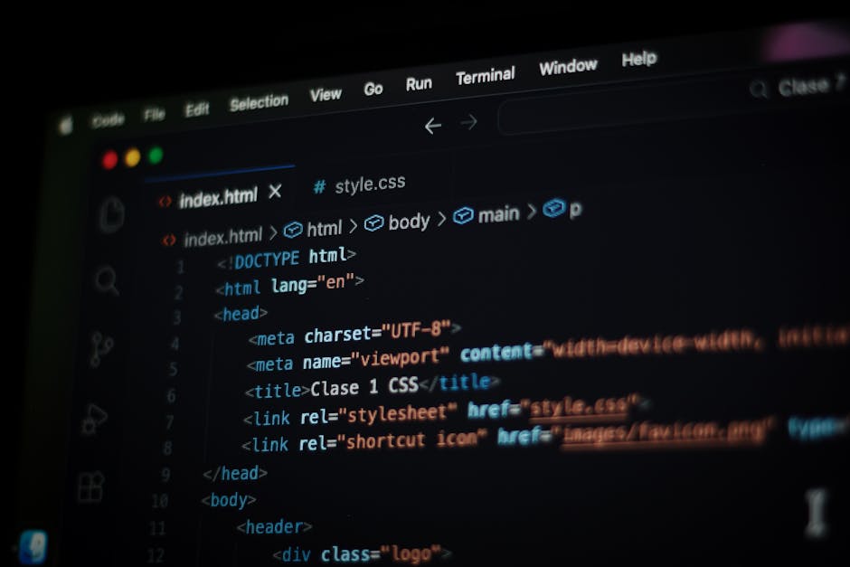 A computer screen displaying a code editor with HTML and CSS code visible. The code includes tags such as <html>, <head>, <title>, <link>, and <meta>, with syntax highlighting in various colors. The b